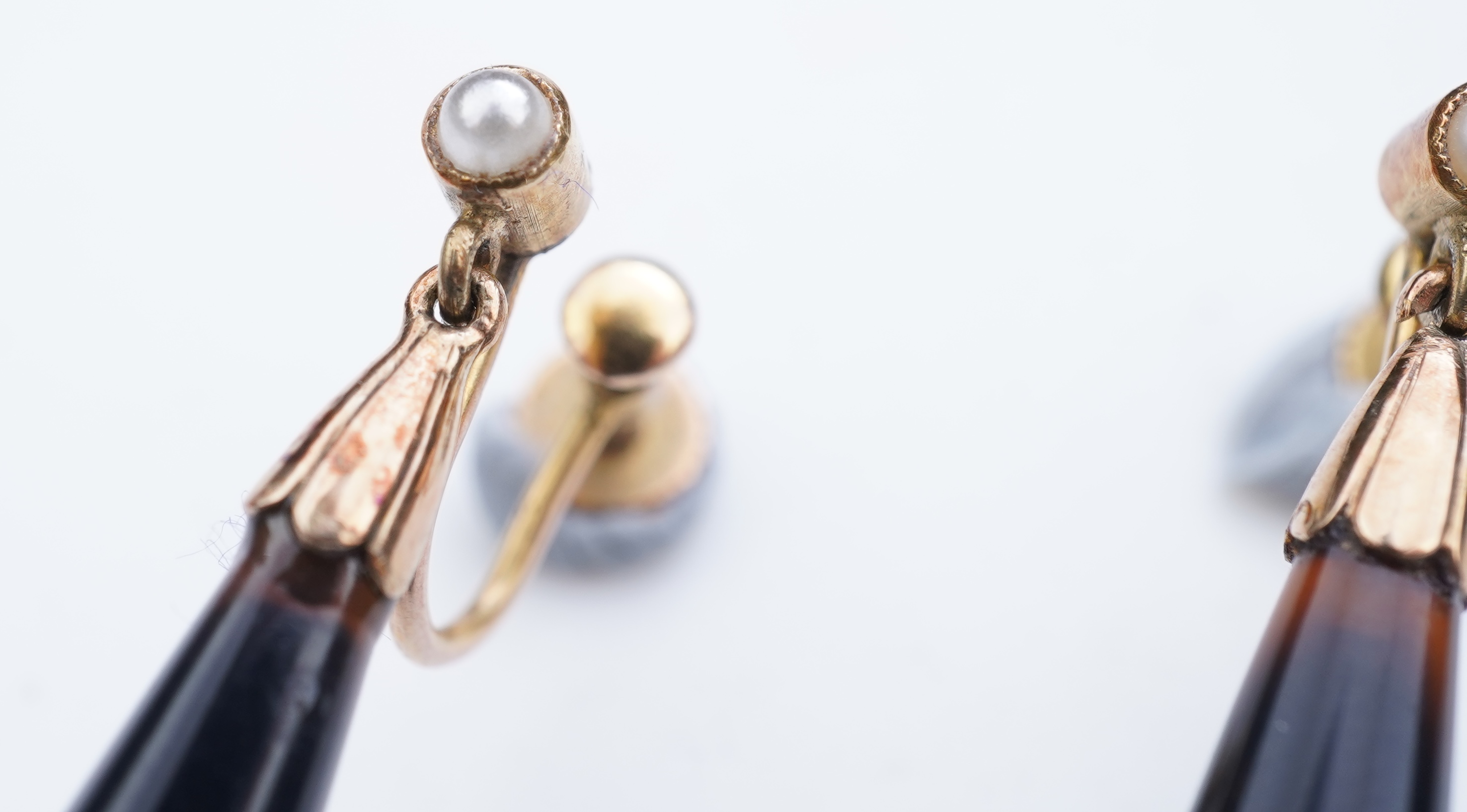 A pair of onyx and split pearl earrings, circa 1900
